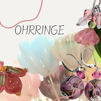 Bunte Ohrringe in verschiedenen Formen und Farben, umgeben von floralen Details. Handmade lampwork