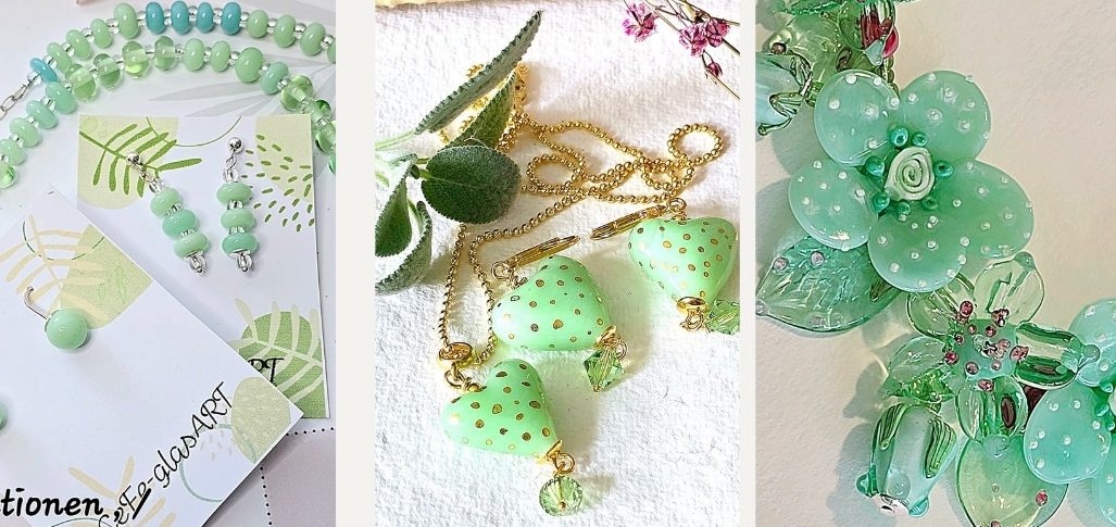 Grüne Glasperlen Blumen und Anhänger, auf hellem Hintergrund.